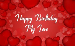 Celebrate love with romantic birthday wishes: Heart-shaped cake, candles, red roses, and a 'Happy Birthday My Love' message.